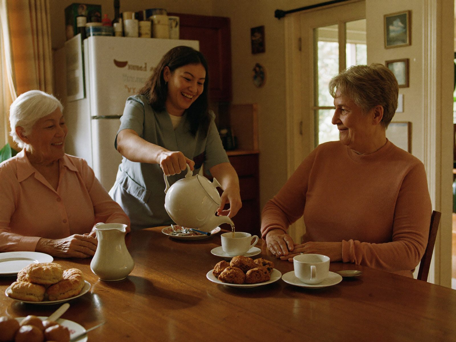 The Divine Care Group team sharing morning tea with clients