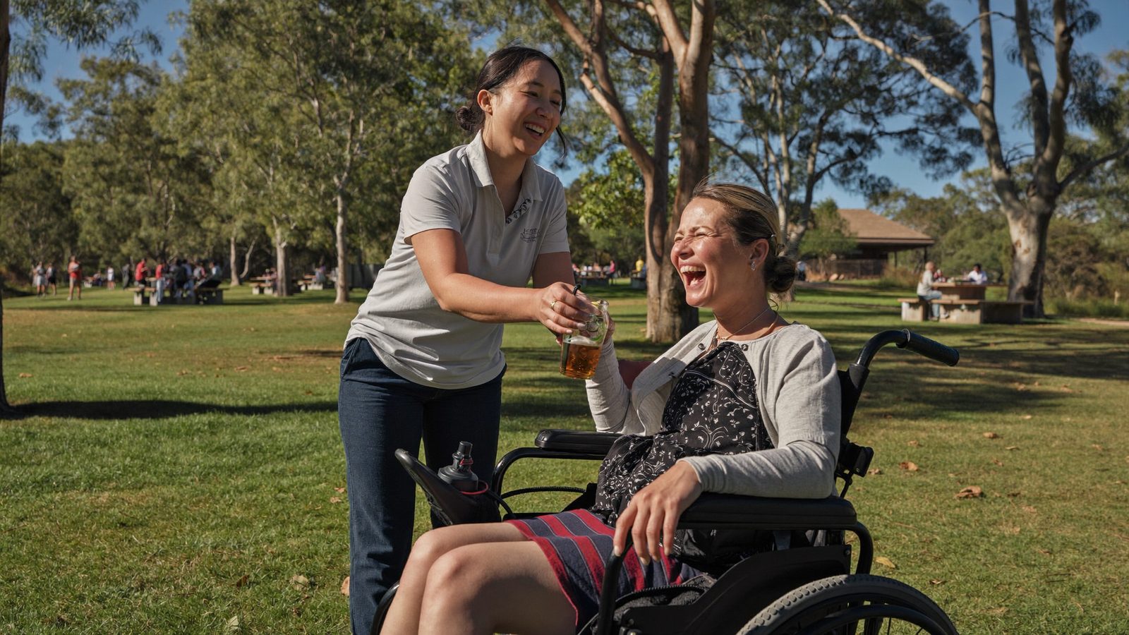 A young NDIS participant enjoying a community activity with their support worker